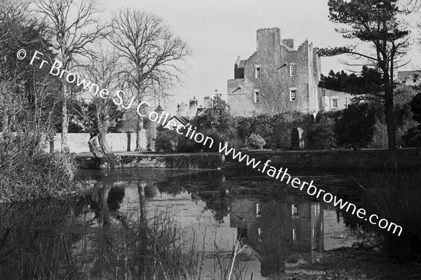 HOWTH CASTLE  LUTYEN'S TOWER (1911) AND STABLES FROM POND